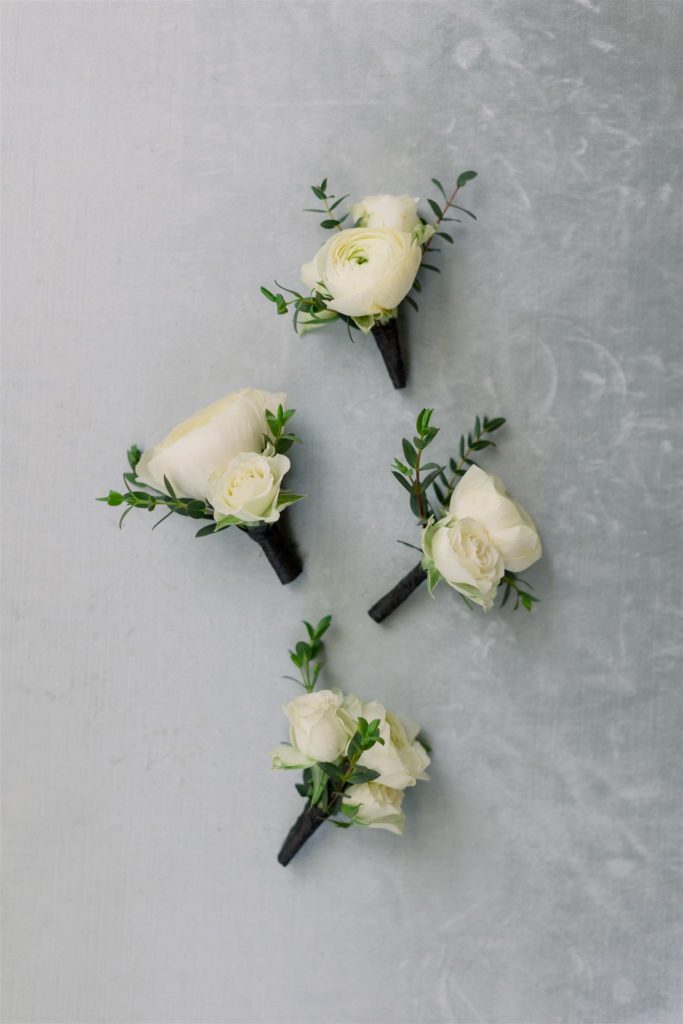 white and green boutonnieres