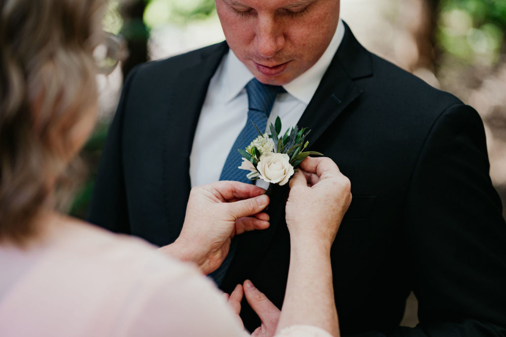 white green and blue boutonniere