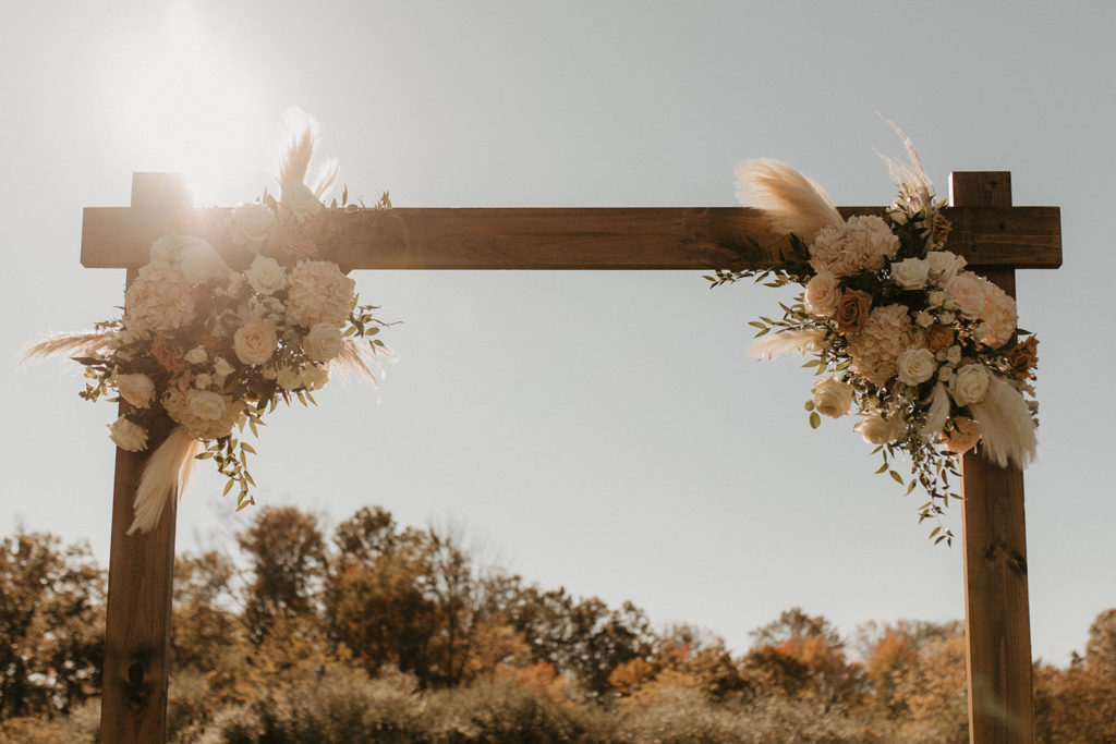 Rustic wedding arch with flowers