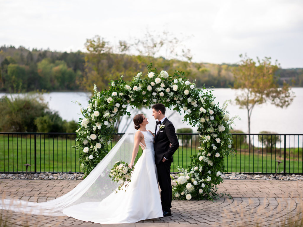 classy and elegant wedding. Full circle arch with white and green florals