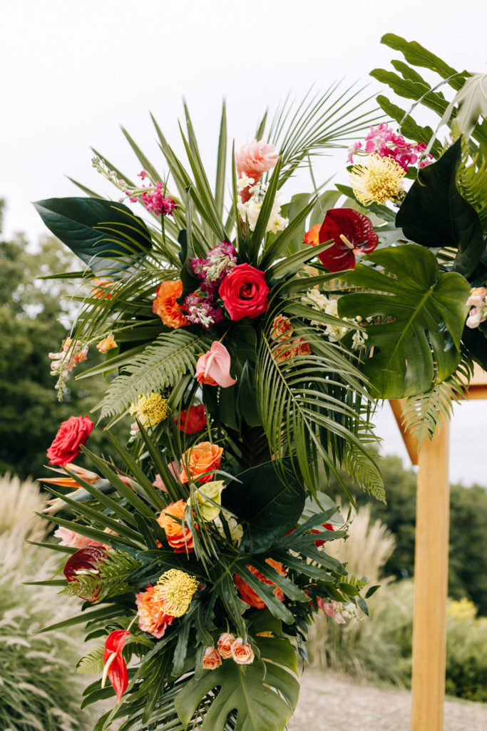 Tropical Wedding Arch with vibrant florals