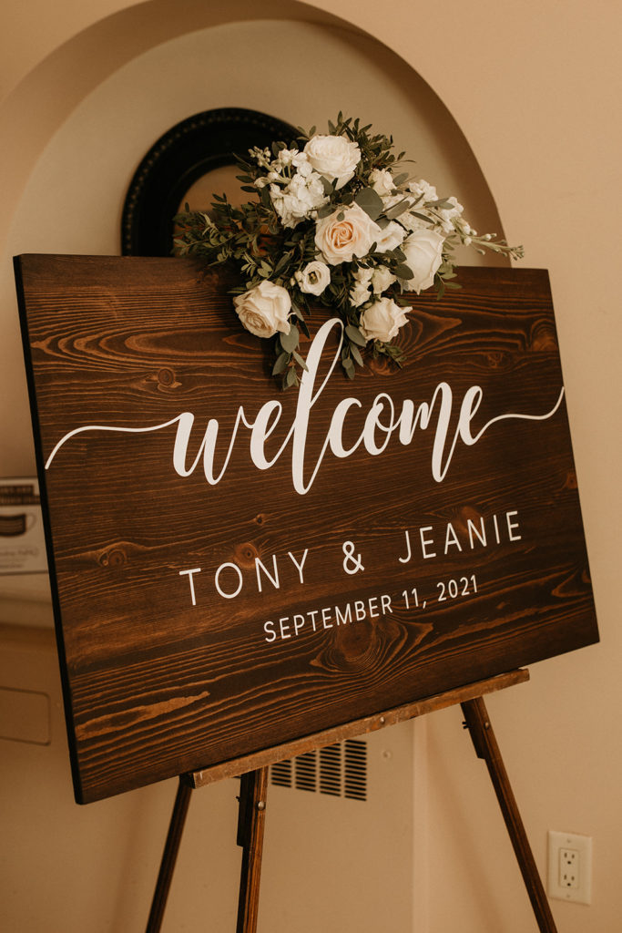 timeless white and green wedding welcome sign