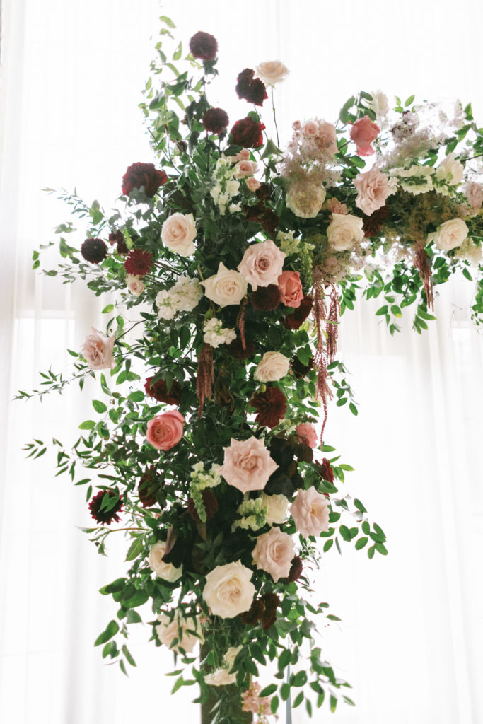 burgundy and blush wedding floral arch