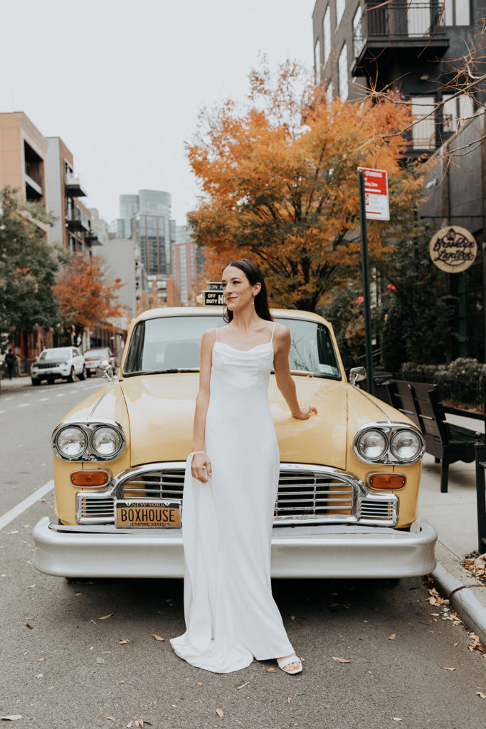 bride with vintage taxi in nyc