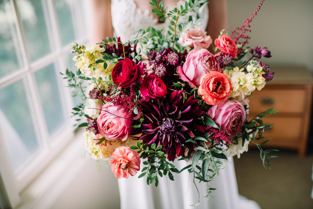 lush and vibrant wedding florals bridal bouquet with dahlias and ranunculus