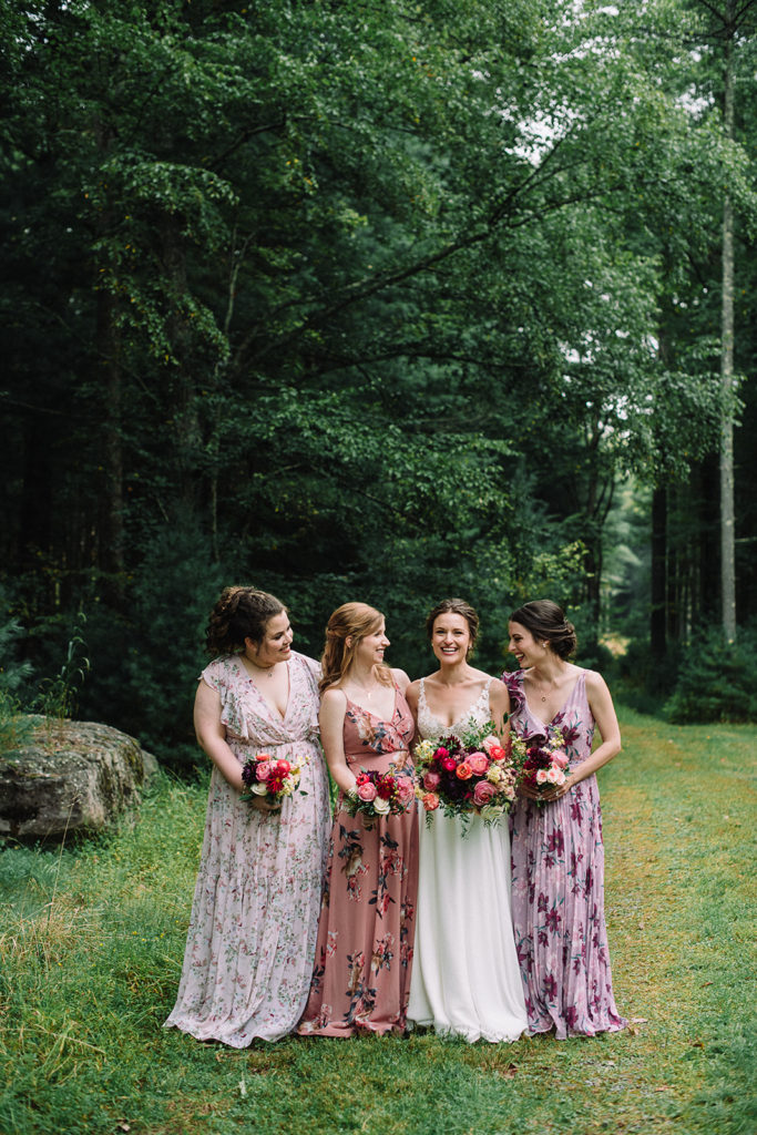 bride and bridesmaids with vibrant floral bouquets