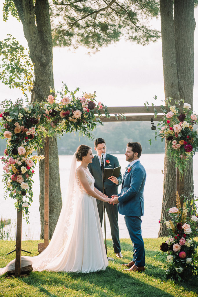 lush and vibrant wedding ceremony with floral accents on a chuppah