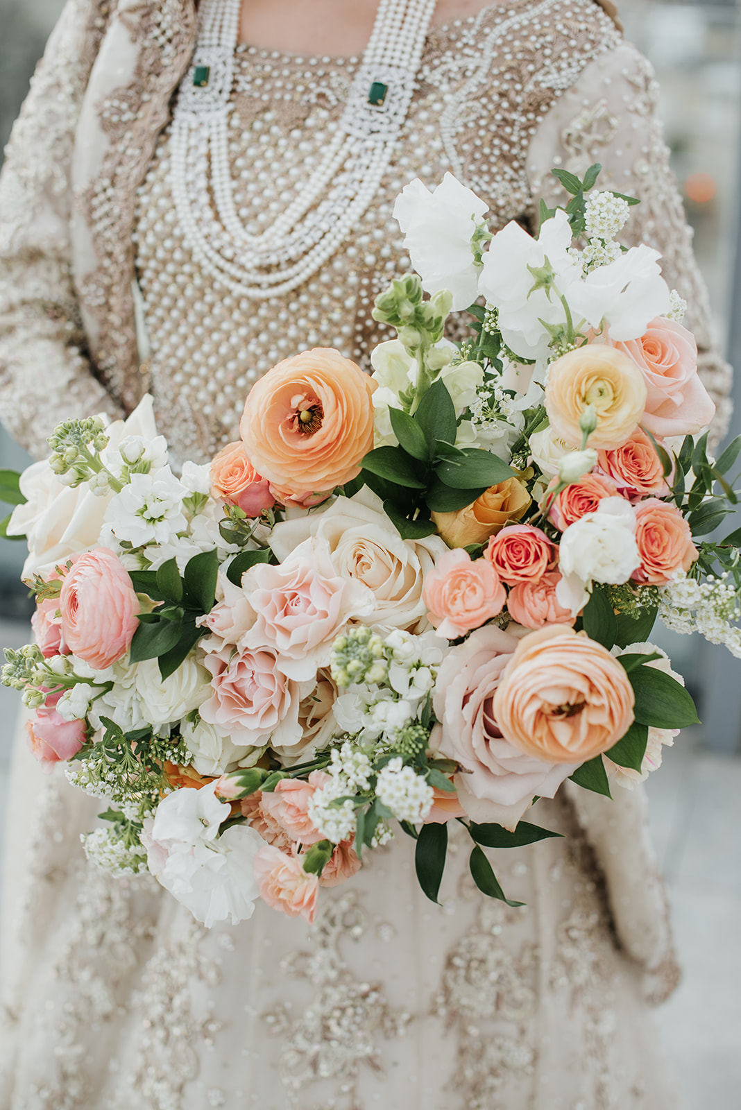 Spring Inspired Bridal bouquet with light pinks and orange
