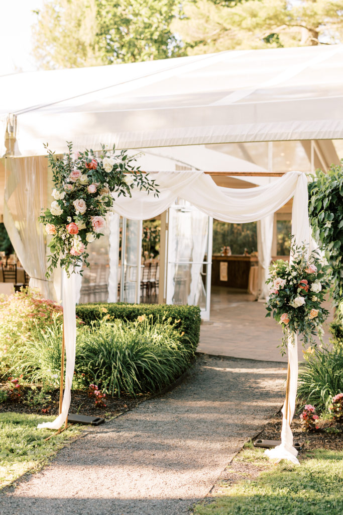 Floral arch for wedding tent entry