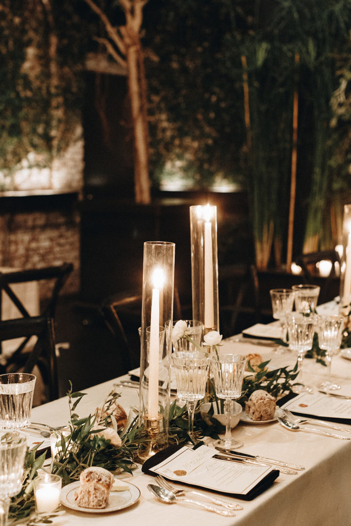 loose trailing greenery and taper candles on reception tables